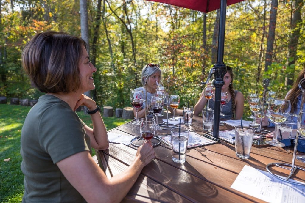 Friends doing wine tasting in Hocking Hills