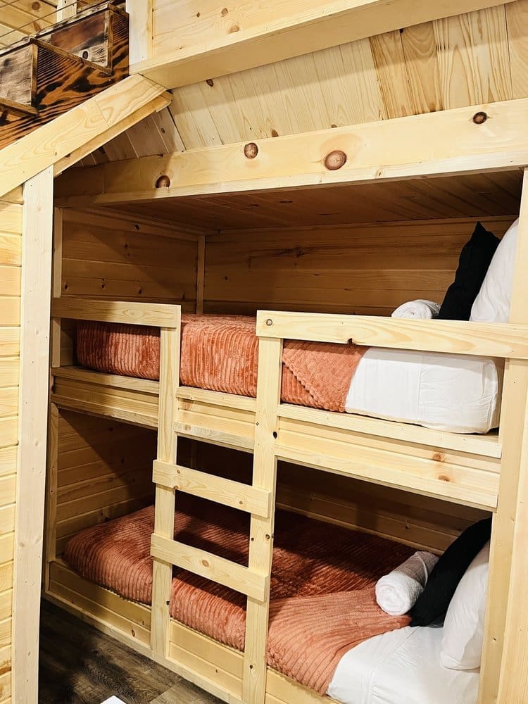 Cozy up in these fun bunkbeds found in the game room.