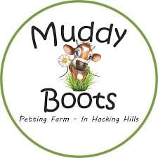Logo for Muddy Boots Petting Farm with cartoon goat