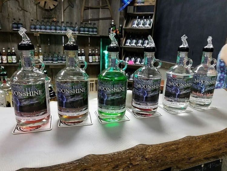 Display of flavored moonshine bottles at Hocking Hills Moonshine