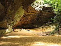 Large horseshoe-shaped cave and waterfall at Ash Cave in Hocking Hills
