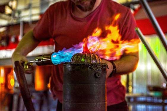 man making a glass masterpiece at Jack Pine Studio